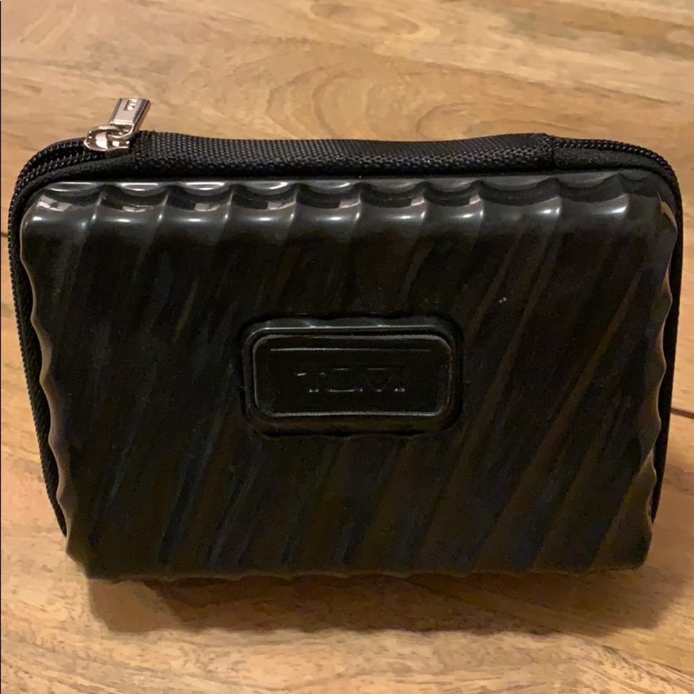 Small hard case TUMI toiletry bag